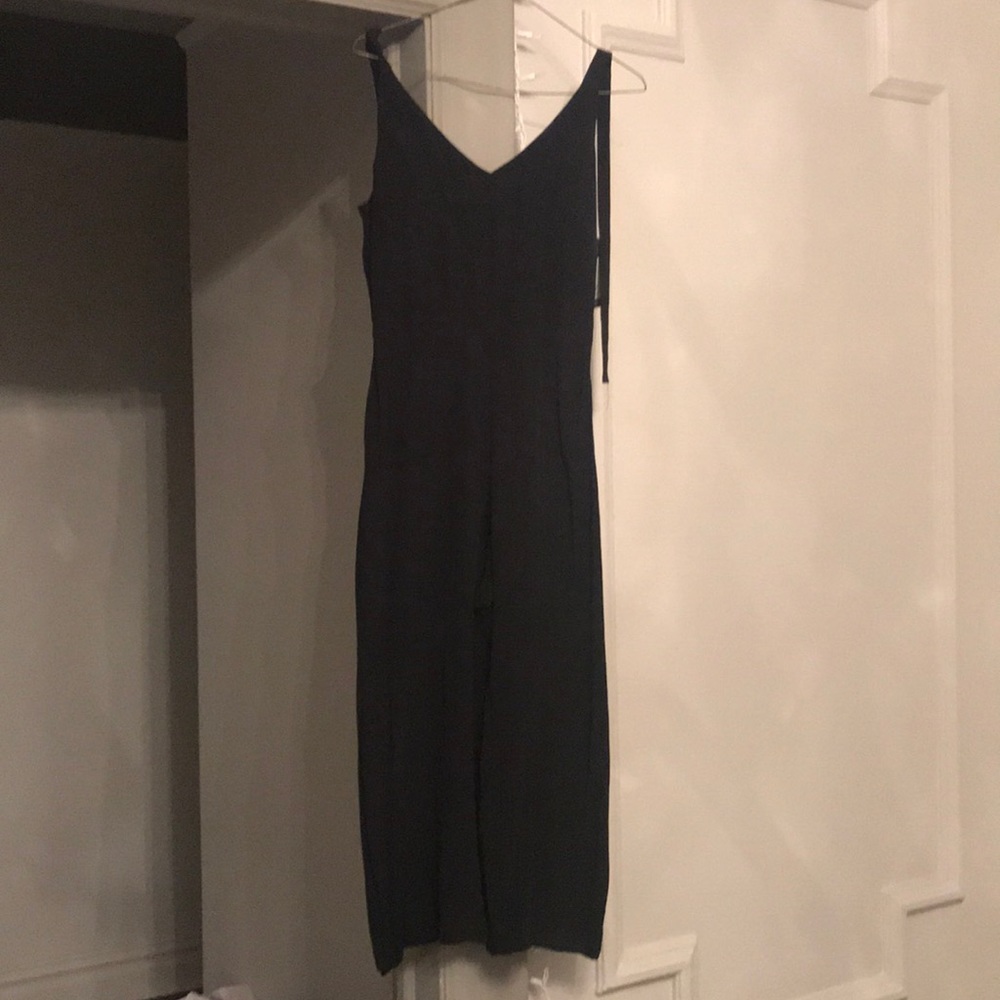 3/4 Black Wide legged Jumpsuit. Runs small.